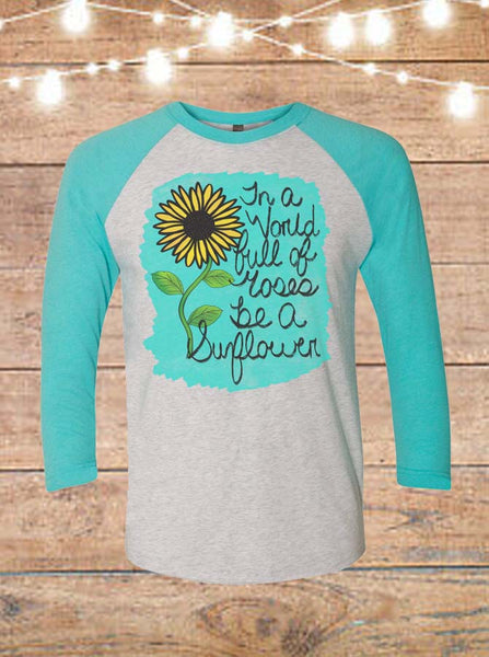 In A World Full Of Roses Be A Sunflower Raglan T-Shirt