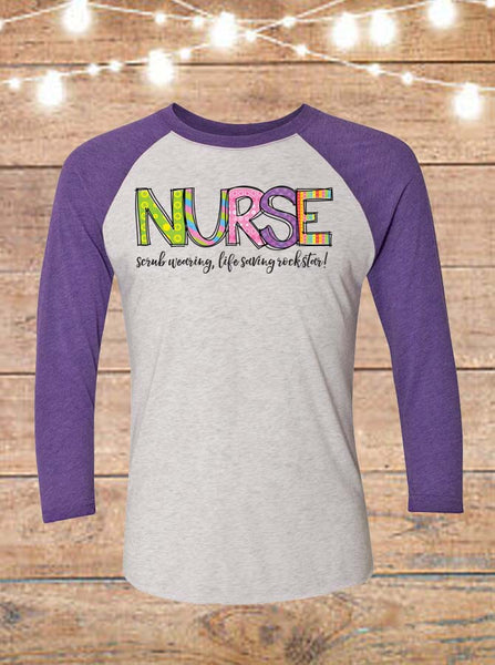 Nurse- Scrub Wearing, Life Saving, Rockstar Raglan T-Shirt